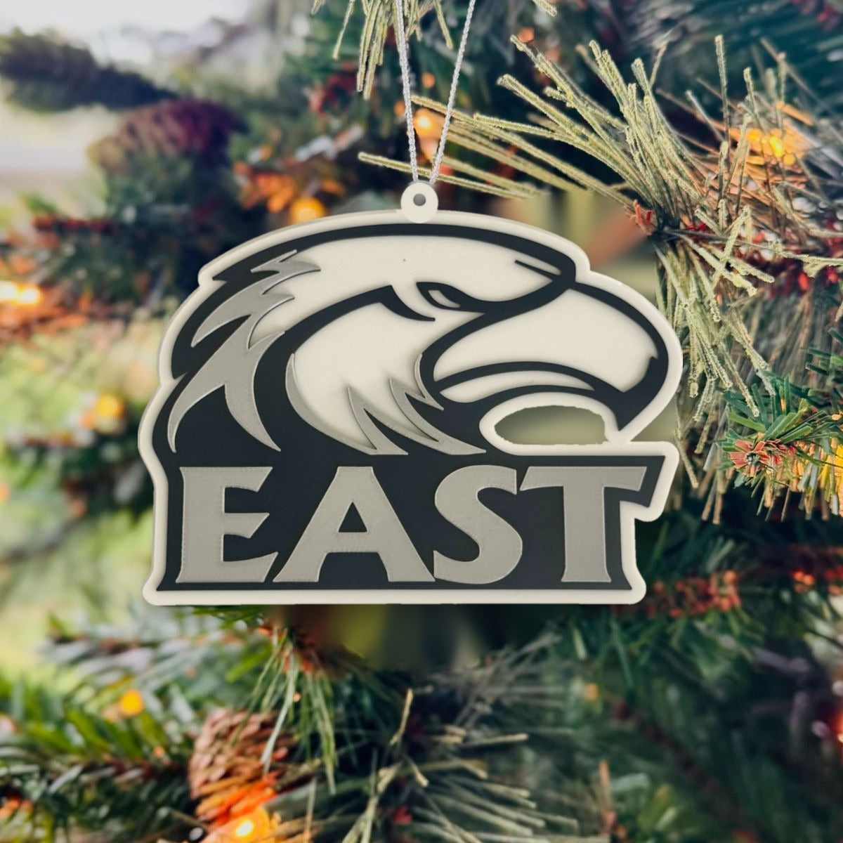 East Jackson Eagles logo Christmas ornament hanging on a tree